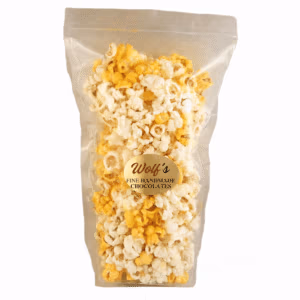 Enjoy gourmet cheddar cheese popcorn from Wolf's Fine Handmade Chocolates made with Indiana corn in a 7oz resealable bag. It's perfect for snacking, sharing, or gift baskets.